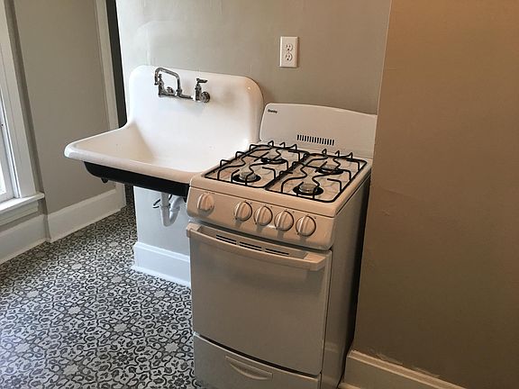 Vintage sink and new gas stove