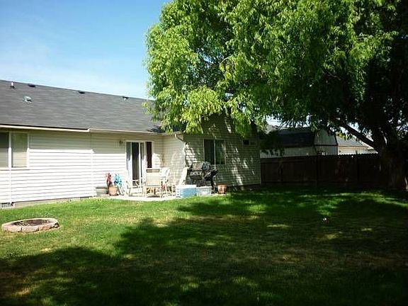 Fully fenced yard with great shade tree