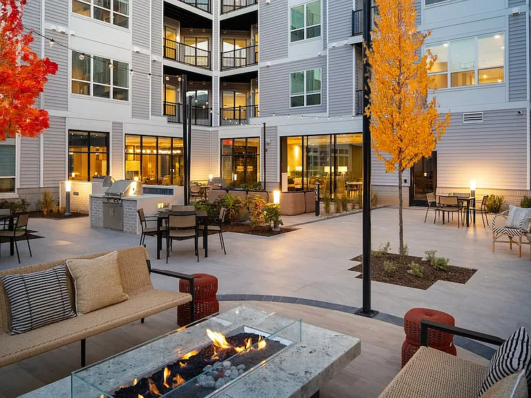 Courtyard with BBQ grills, fireplace, and lounge seating
