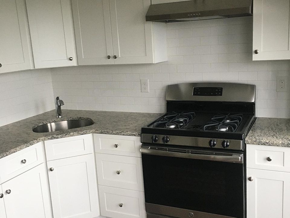 Kitchen granite counter tops, stainless steel stove