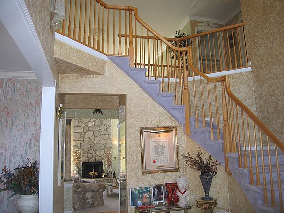 Entry via inviting foyer, introducing this sophistically designed premium home