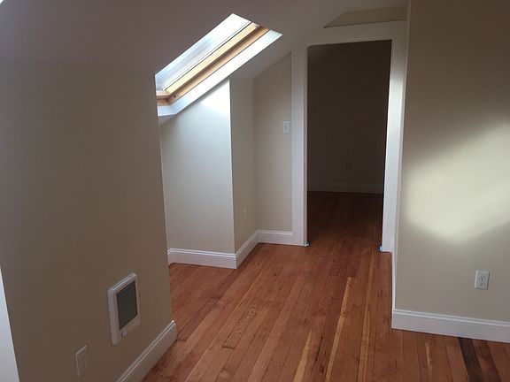 bedroom 1 with new refinished floors new window and roof win