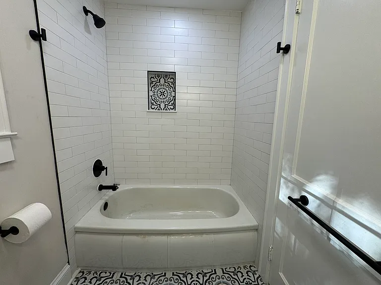 Hall bathroom with shower tub