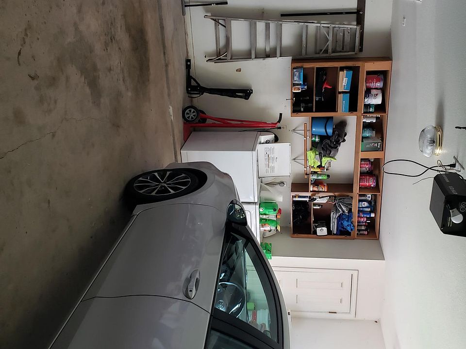 Two car garage with shelves attic and attic space for lots of storage.