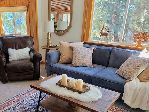 Living room offers large couch and comfortable accent chair
