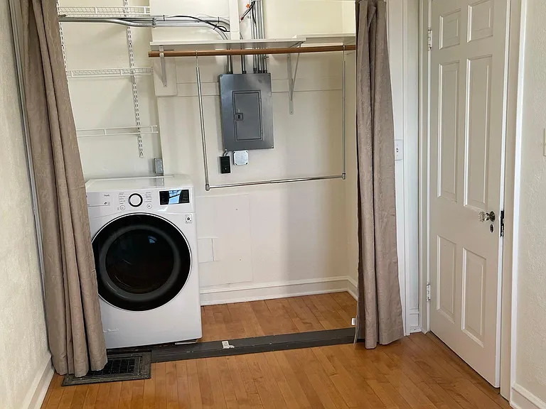 Bonus Room/Office 2 of 3. Large closet for wardrobe, additional storage and for the included dryer. This room also has a ceiling fan and a skylight with remote-controlled window sash and blinds.