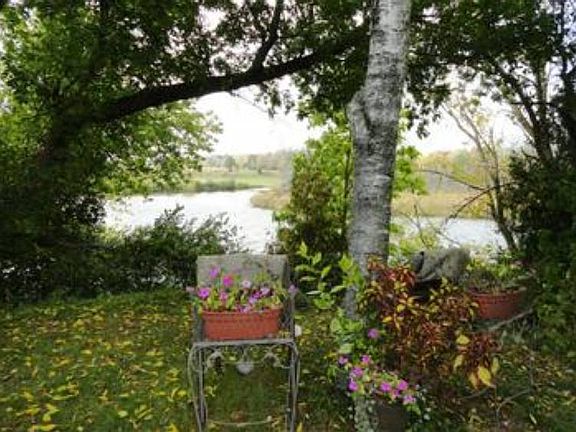 A quick walk down the set of stairs alongside the outbuilding will lead you to this private park like waters edge! With 100 ft. of quiet waterfront you'll almost feel like it's your very own river! There's plenty of space for you to drop your own dock in! The fun is just waiting to be had!