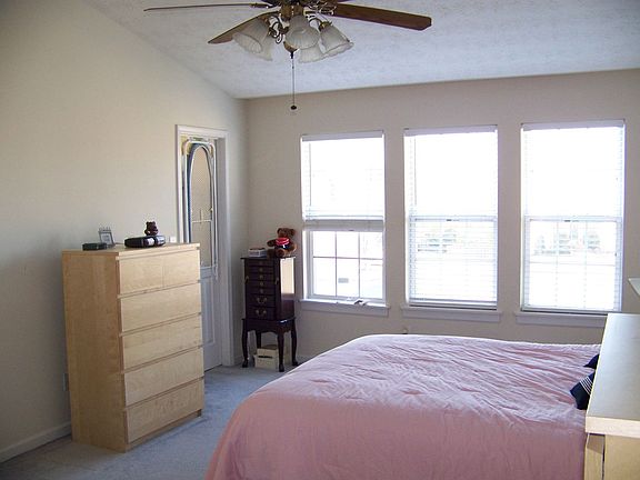 Bright master bedroom with vaulted ceilings