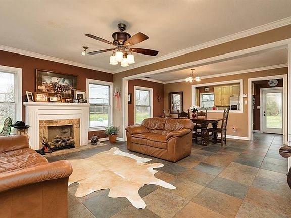View of the home from the front door. Open floor plan shows living room, dining room and into the kitchen. Wonderful lay out for hanging out with friends!