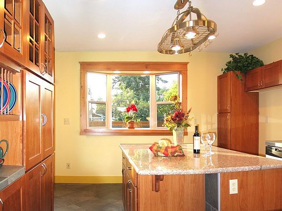 Custom Granite Kitchen with Cherry Cabinets and New Stainless Appliances