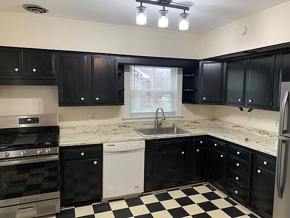 Big updated kitchen with new lighting, sink/faucet, appliances, countertops. Lots of light and cabinets.