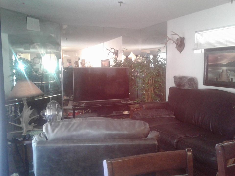 Living room. Mirrored Walls. Currently occupied.