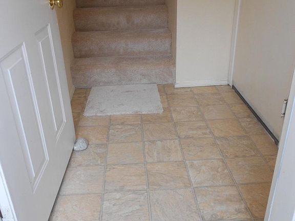 New floors in entry, bathrooms, & den