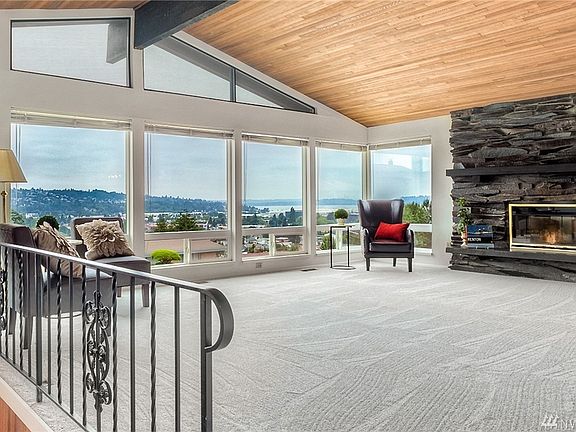 Living room with sweeping views of Lake Washington and surrounding area! 