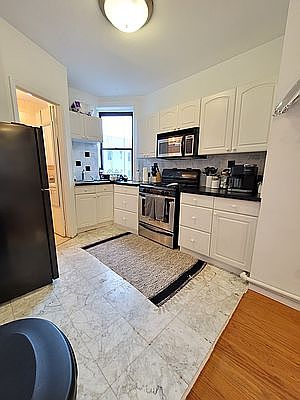 1st image of 312 E 9th St APT 15