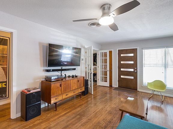 front entry and living area. French doors on left to office