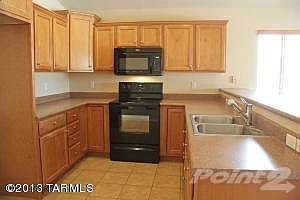 Open Kitchen with Rich Wood Cabinets