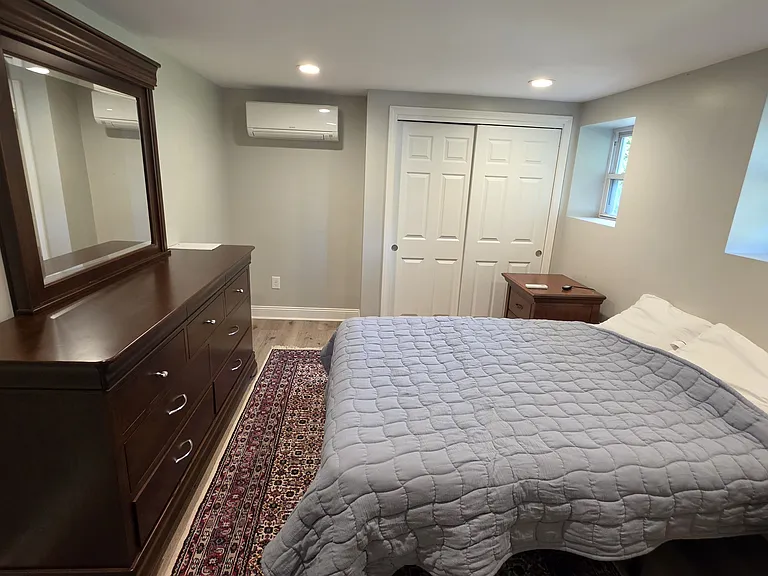 3rd bedroom with mini split and large dresser