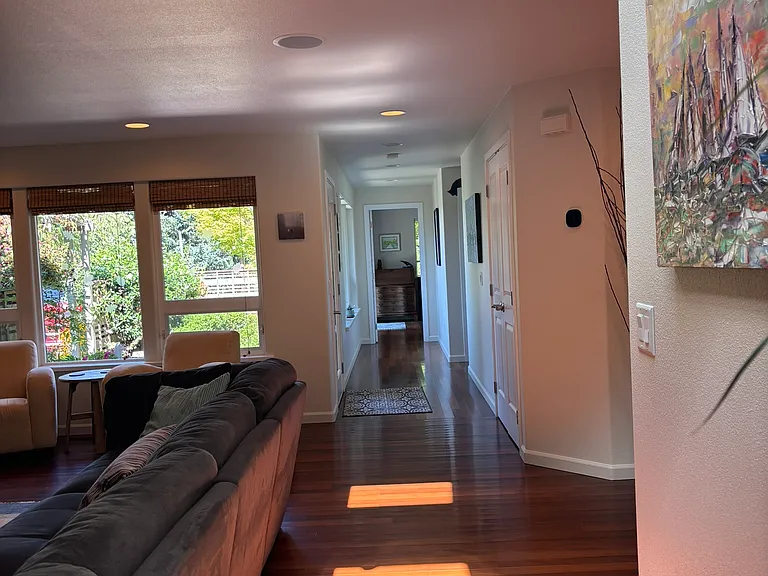 living room looking north, past front door and down hall to office, 2nd bedroom and main bath