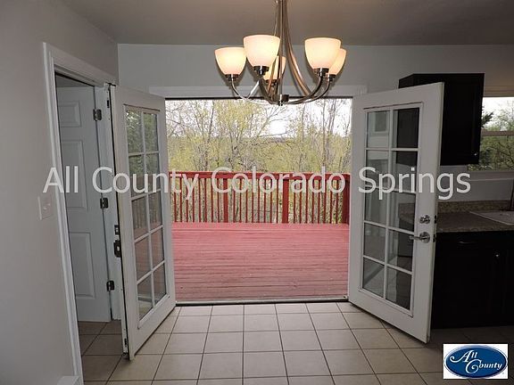 Double french doors to patio with views of downtown