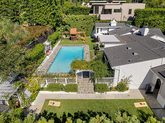 Bird's eye view of the pool and backyard, a haven of relaxation and recreation.