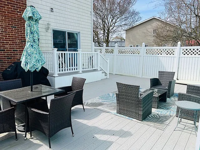 included on the back deck - seating area, dining set, and propane gas grill