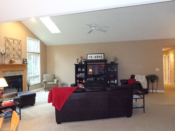 View from dining area and kitchen. Ceilings have various heights.