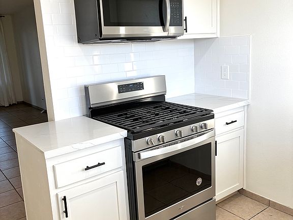 Kitchen with new stainless steel appliances