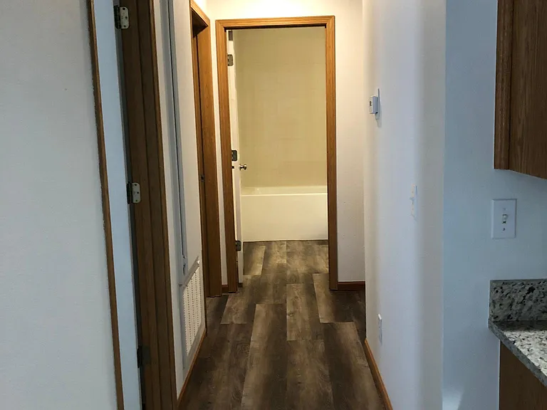 Hallway - Bedroom 1 & 2 on right, Main bathroom at end of hall and Master Bedroom on right at end of hall