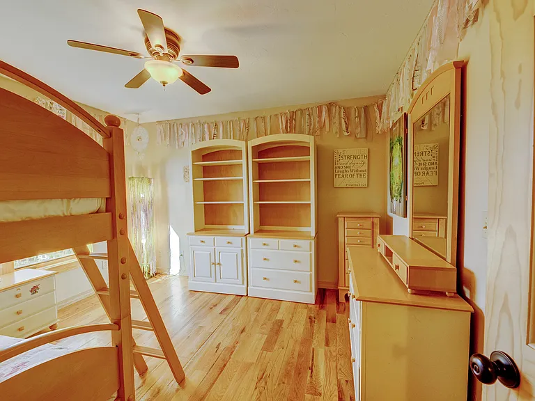 Large bedroom with real wood floors. Can switch out the furniture for whatever size bed needed.