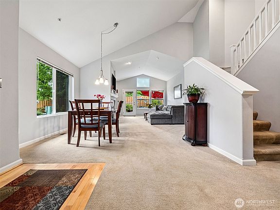 As you walk in the home you'll notice the formal dining space to the left and the large living room.>