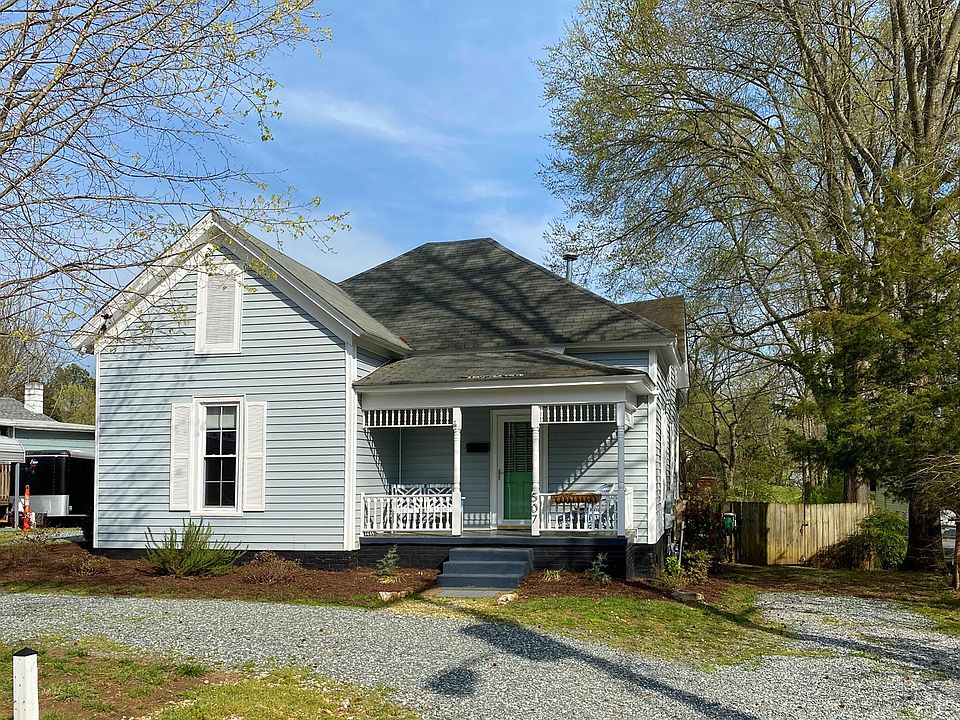 Cozy front porch and plenty of driveway parking