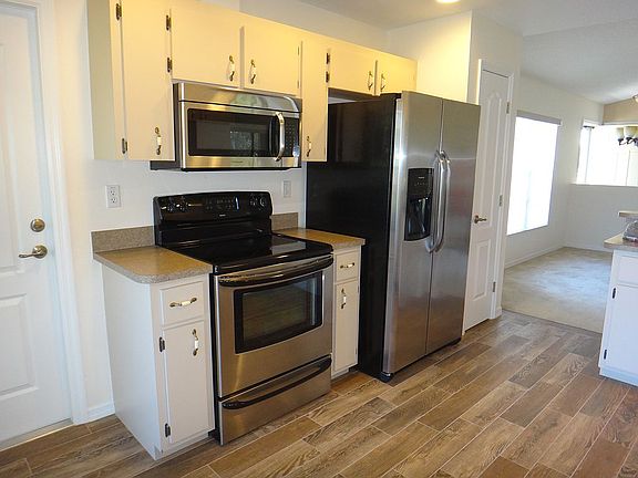 Kitchen with wood tile floor