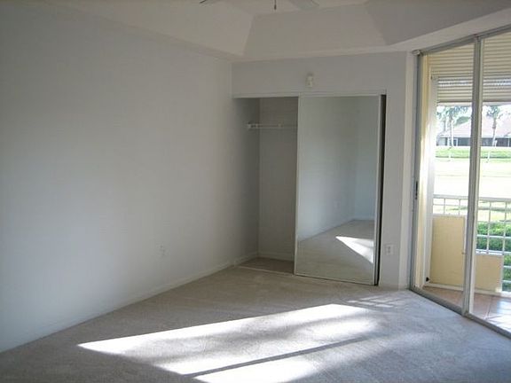 Master bedroom with sliders to patio