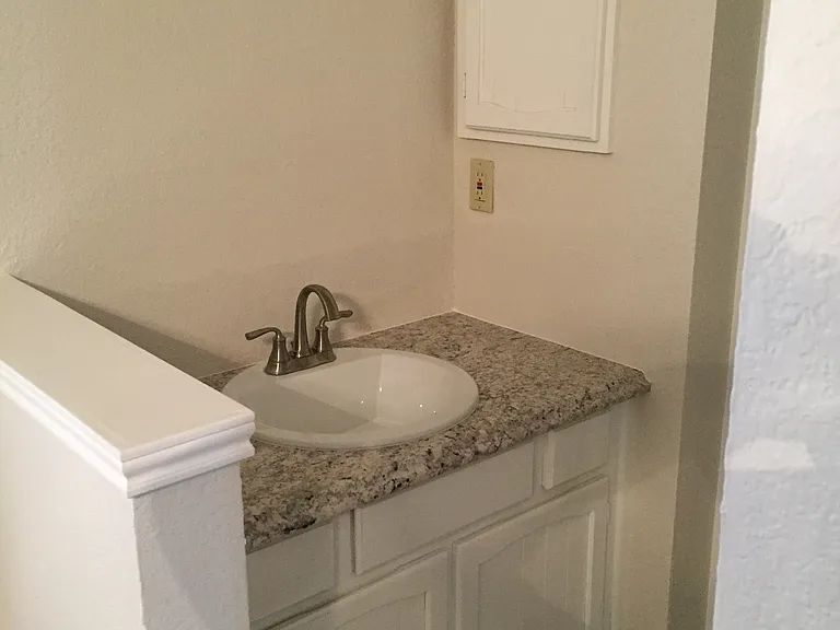Remodeled bath with new sink and countertop