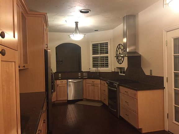 Full custom Kitchen with Kitchen Aid appliances built in ref