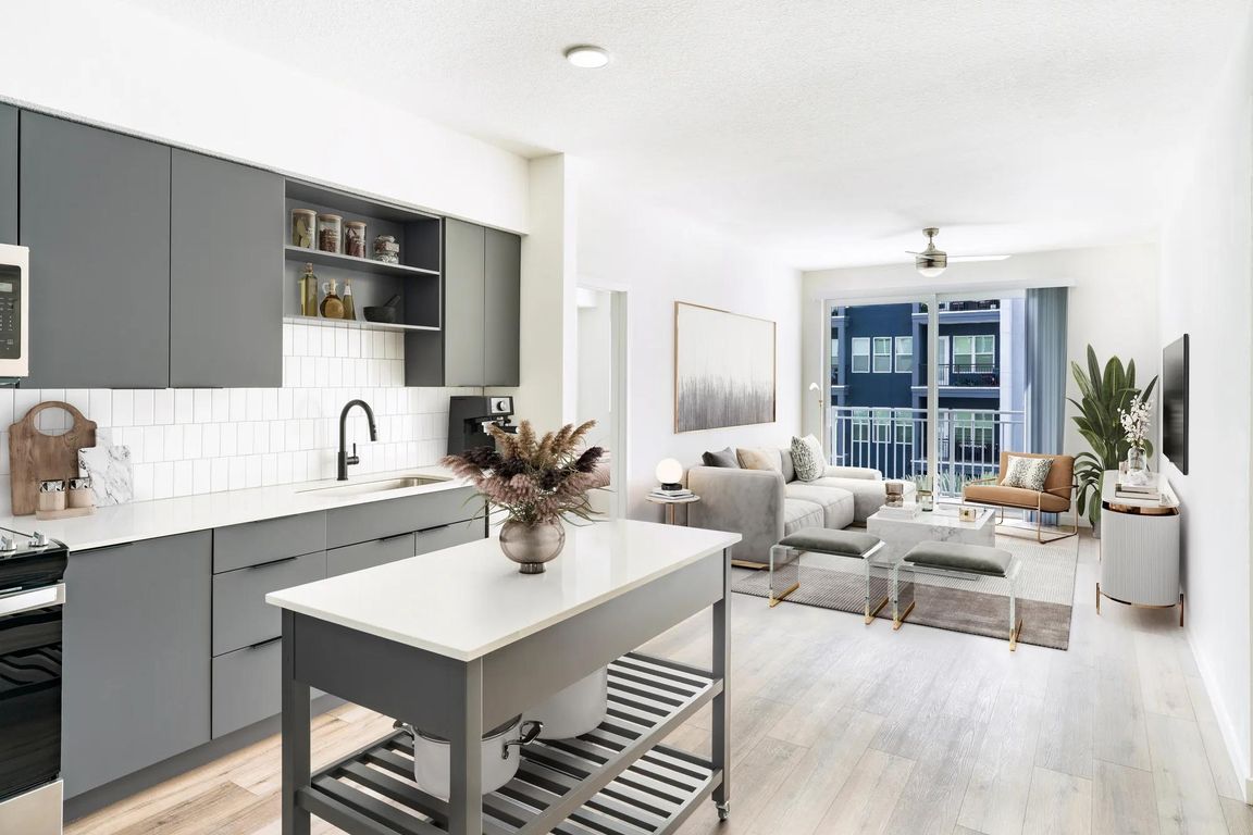 An inviting layout where the kitchen and living area connect seamlessly, offering effortless flow throughout your Modera Encore home.