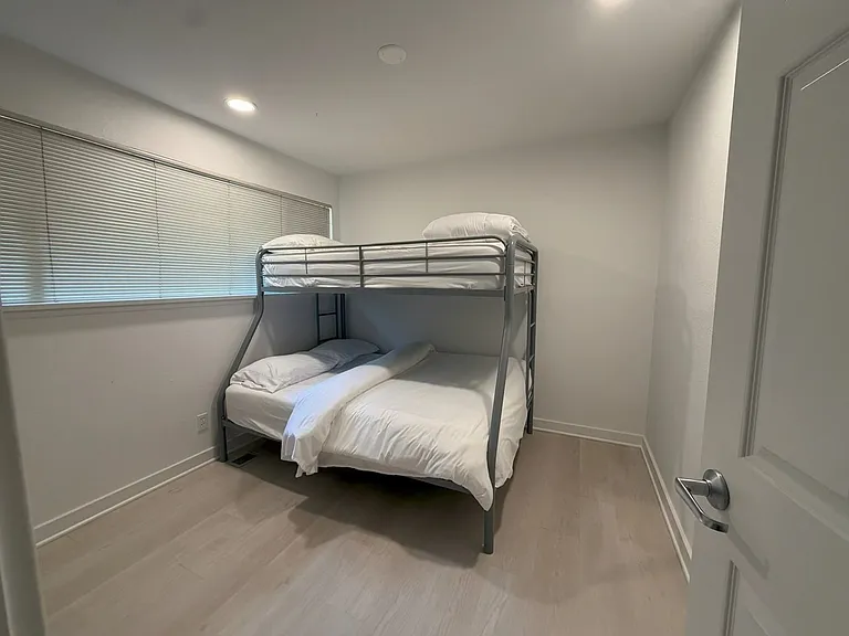 Downstairs bunk bed. Top bunk is a twin; bottom bunk is a full