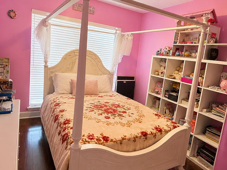 A smaller bedroom that fits a Full size bed and two shelves. Can fit a Queen bed as well. More closet space here.