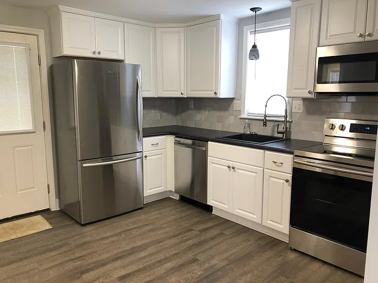 Fully remodeled kitchen with all new stainless steel refrigerator, range, microwave, dishwasher and in-sink disposal.