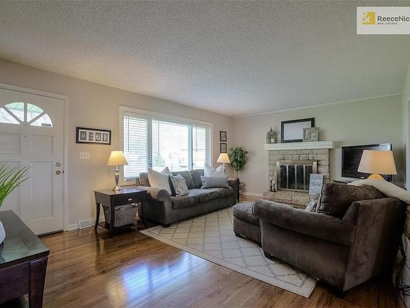 Large family room with gleaming hardwoods