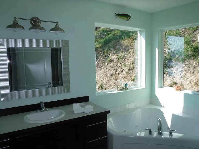 Master Bathroom with jetted tub, toilet and shower rooms.