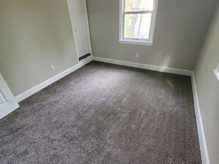 Large bedroom view from closet area