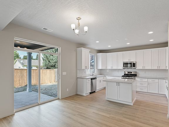 Kitchen. Brand new appliances. *Blinds have since been installed throughout the house.