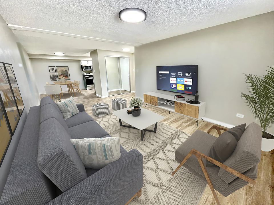 Living room, main entry and kitchen