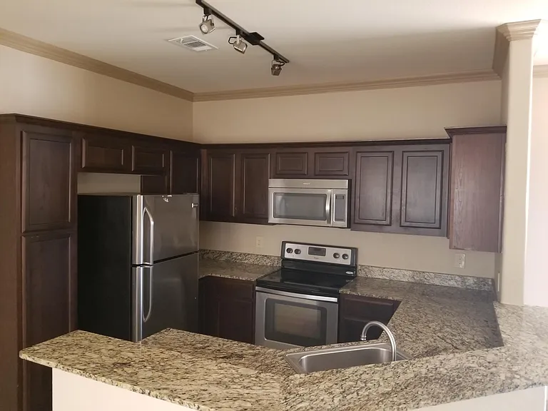 kitchen area- stainless steel appliances.