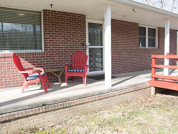 Front porch with ramp and stairs on each side