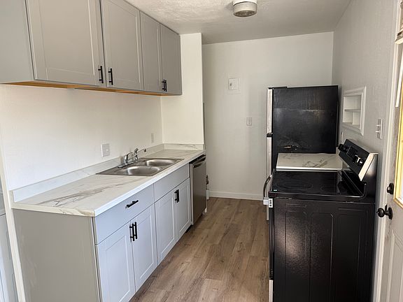 Kitchen with new appliances, cabinets, countertops, paint