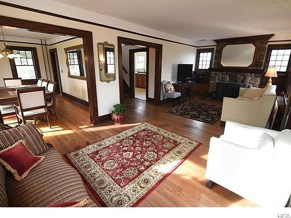 Fabulous open floor plan.  Living room with stone fireplace, den, and dining room.