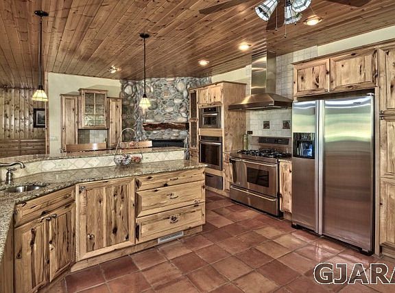 Custom hickory cabinets with 48'dual gas stove with bread oven, plus built in ov